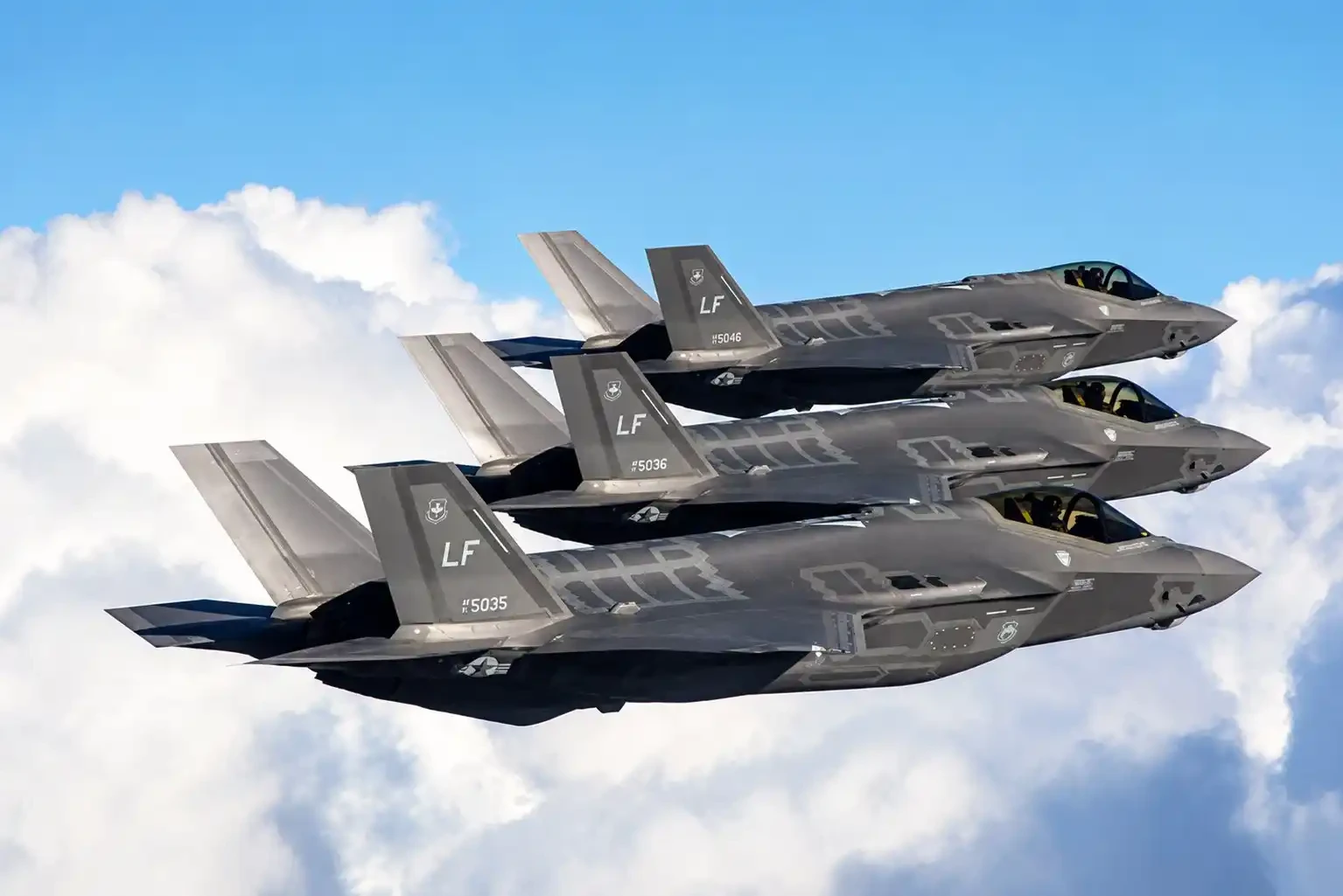 A formation of three Lockheed Martin F-35A Lightning II stealth fighter jets from the Luke Air Force Base